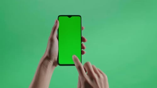 Hand Tap Touch Green Screen Smartphone On The Green Screen Background