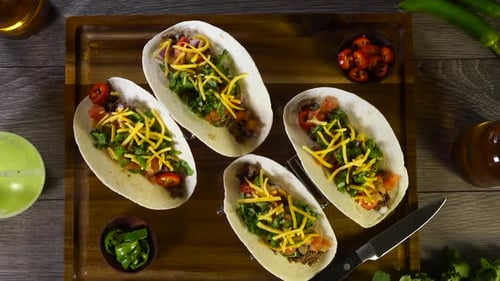 Overhead Shot of Four Delicious Tacos on Wood