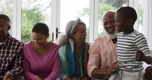 Happy Family Spending Time Together on Couch Indoors