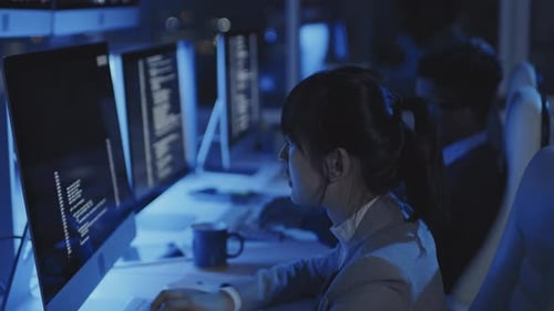 People Working in Dark Office
