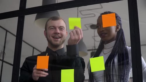 Colleagues Working Together on Project in Office