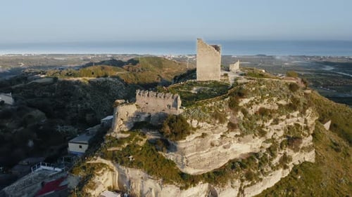 Overview of the Ancient Castle with Damaged Tower of a Vintage Town