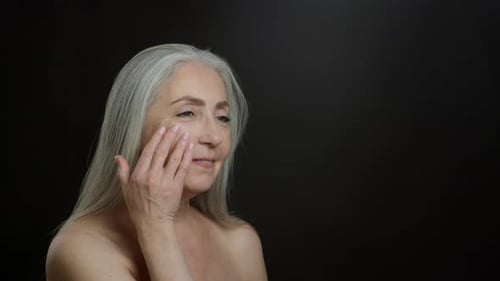 Adult Woman Massaging Face for Skincare