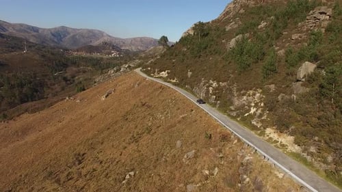 Travelers Drive a Car in the Mountain