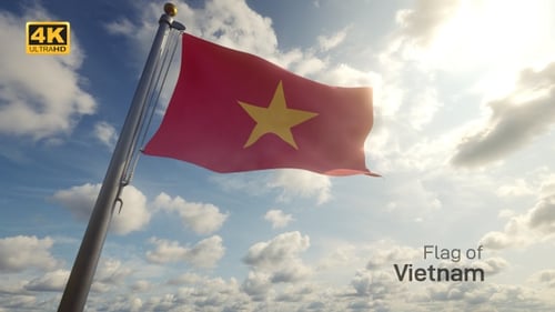 Waving Vietnam Flag Against Bright Sunny Sky with Clouds