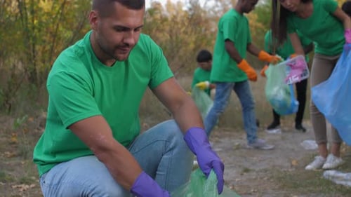 Volunteers Cleaning Up Litter in Woodland