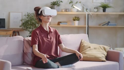Woman Using VR Headset for Relaxing Meditation