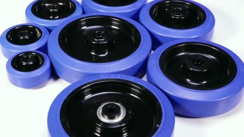 Blue and Black Wheels on White Surface