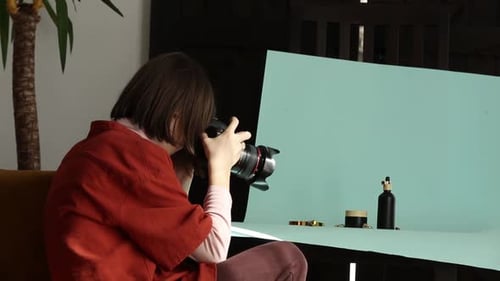Woman Photographing Beauty Products in Studio