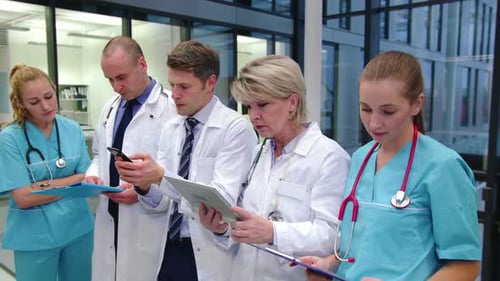 Medical Professionals Reviewing Documents at Hospital