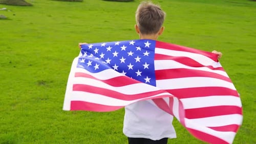 Blonde Boy Holding American Flag Outdoors