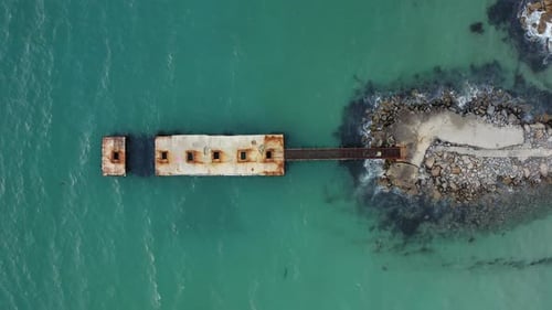 Old Pier in the Sea Surrounded By Clear Turquoise Water