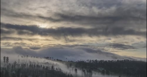 Fog Rolling Over Mountains at Sunrise