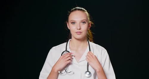 Young Woman Doctor Smiling with Stethoscope