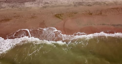 Top Down View of Waves Breaking in the Sand, Flying Over Tropical Sandy Beach and Waves