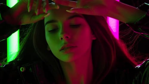 Fashionable Woman Posing with Neon Lights