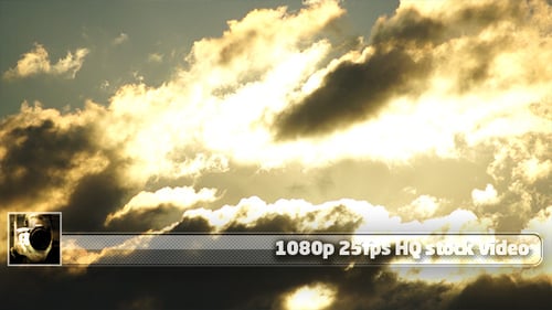 Golden Sunlight Streaming Through Dramatic Clouds