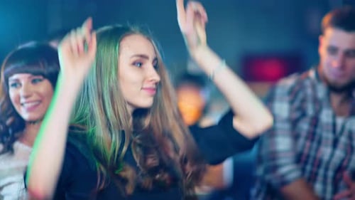 Young Adults Dancing and Having Fun in Nightclub