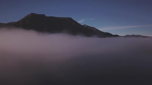 Morning mist above lake aerial