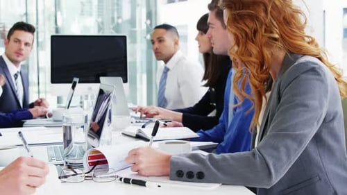 Business Team Working at a Table in Office