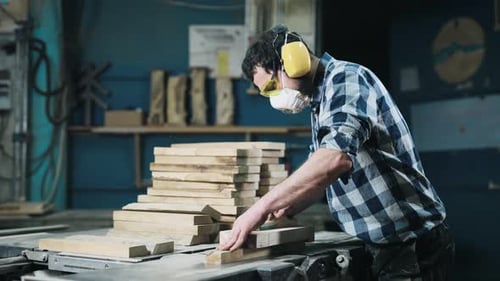 A Man Works with a Planer