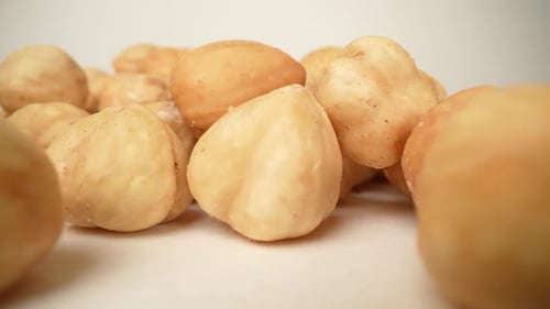 Close Up of Fresh Hazelnuts on White Surface