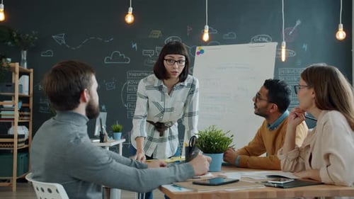 Creative Team Men and Women Talking in Office, Girl Writing on Whiteboard