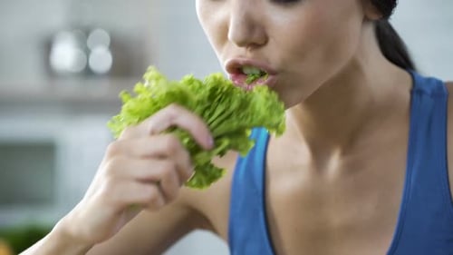 Wishing Lose Weight and Be Slim, Lady Making Herself Eating Lettuce, Nutrition