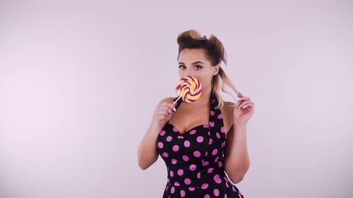 Glamorous Woman Posing with Lollipop