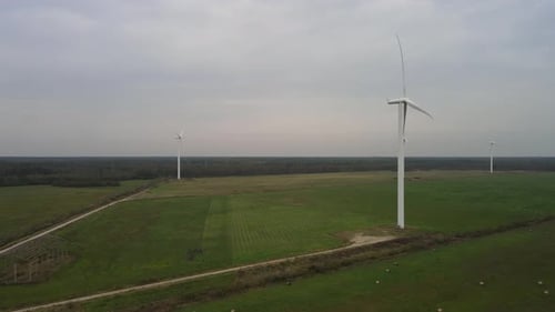 Wind Turbines in Rural Green Field, Aerial Shot