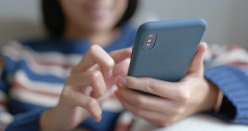 Close up of hands using a smartphone