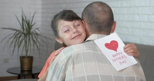 Girl Gives Father a Heartfelt Hug for Father's Day