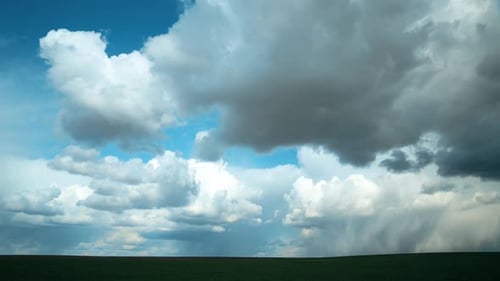 Dramatic Sky Before Rain With Rain Clouds On Horizon Above Rural Landscape Field Meadow
