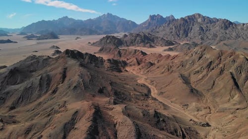 Day top view of the Sahara desert, desert mountains. Sands.