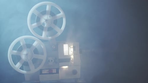 Vintage Film Projector Spinning Reels with Light Beam