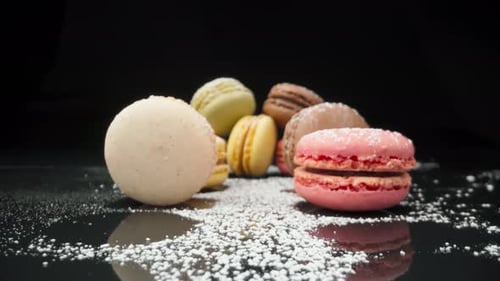 Delicious Macarons Close Up on Black Surface