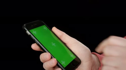 Closeup View of Person Touching Chromakey Screen on Phone
