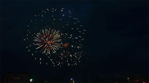 Colorful Fireworks Exploding in the Night City Sky