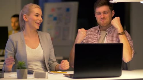 Business Team Making High Five at Night Office 92