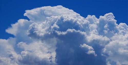 White Puffy Clouds Against Azure Sky