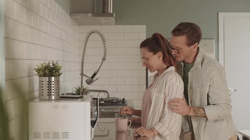 Romantic Couple Together in Modern Kitchen