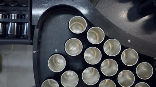 Overhead View Of An Empty Beer Cans Moving On The Conveyor System Of Canning Machine