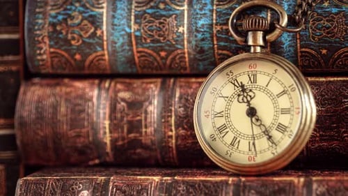 Vintage Pocket Watch and Stack of Antique Books