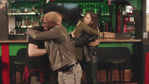 Multi-Ethnic Friends Meeting At Bar At Night