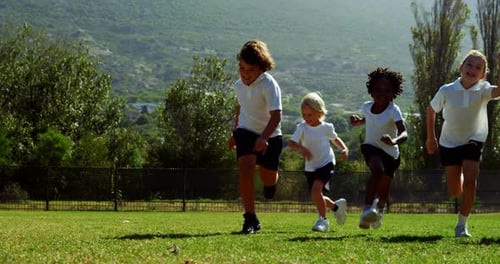 Children running in park during race