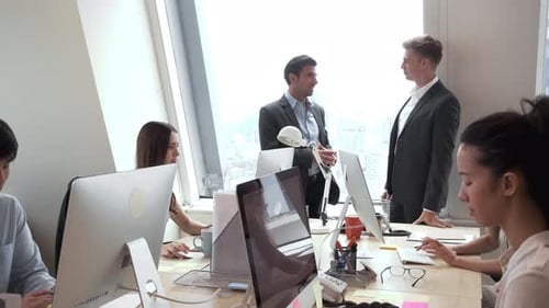 Group of business people working in the office on high rise building in the city