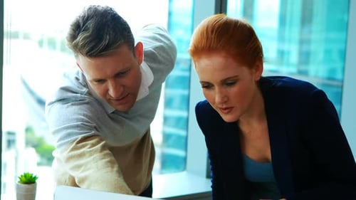 Business Professionals Working Together in Modern Office