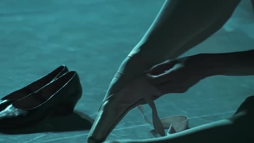 Ballet Dancer Tying Shoes, Close Up View