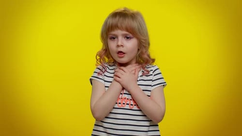 Little Girl Coughing from a Sore Throat