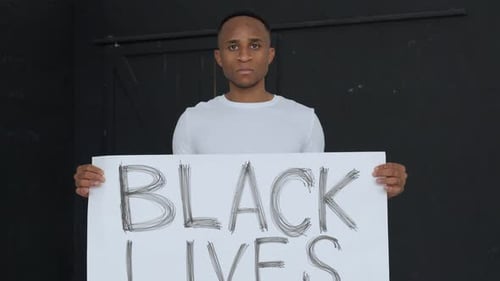 Young Adult Holding Black Lives Matter Sign